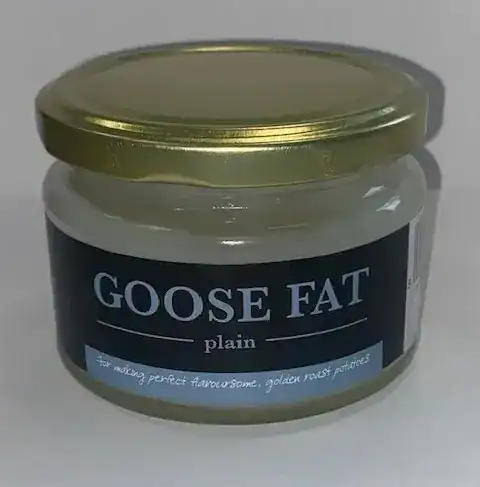 Glass jar of plain goose fat with a gold screw lid