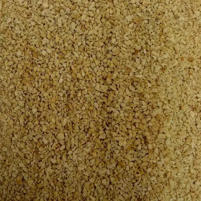 Close-up of pinhead rusk, a coarse pale golden crumb