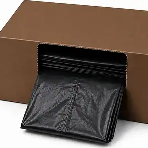 Folded black refuse sacks dispensing from a plain brown cardboard box