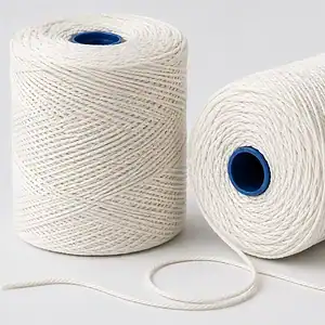 Two balls of white No 5 butchers string on blue plastic cores, one unwound