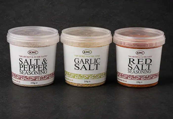 Three 250g KMC seasoning tubs — salt and pepper, garlic salt and red salt