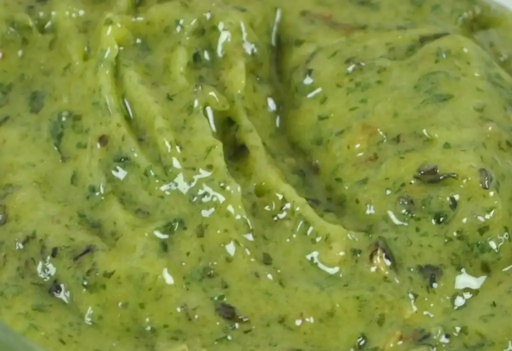 Close-up of RAPS Kiev marinade, a thick green garlic and herb paste