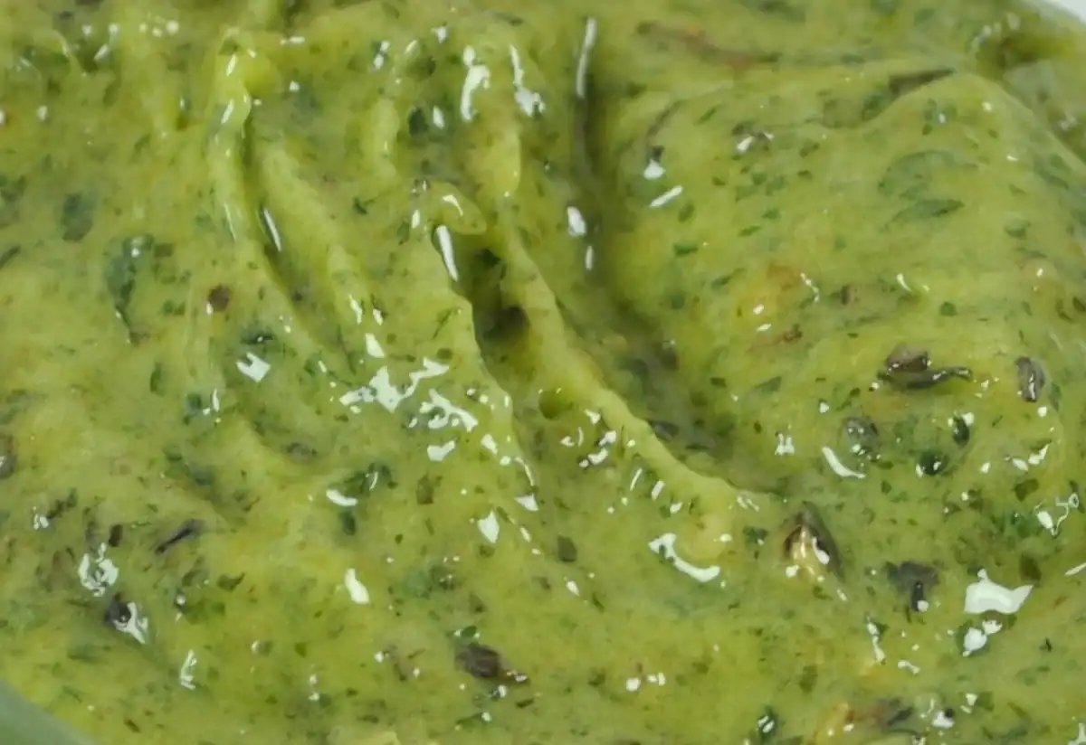 Close-up of RAPS Kiev marinade, a thick green garlic and herb paste