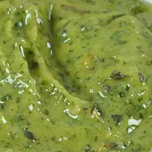 Close-up of RAPS Kiev marinade, a thick green garlic and herb paste