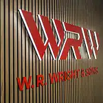 The W.R. Wright & Sons logo in red lettering on a slatted oak wall