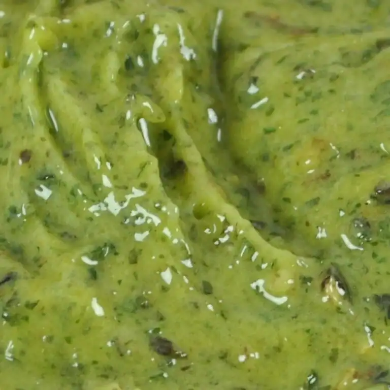 Close-up of RAPS Kiev marinade, a thick green garlic and herb paste
